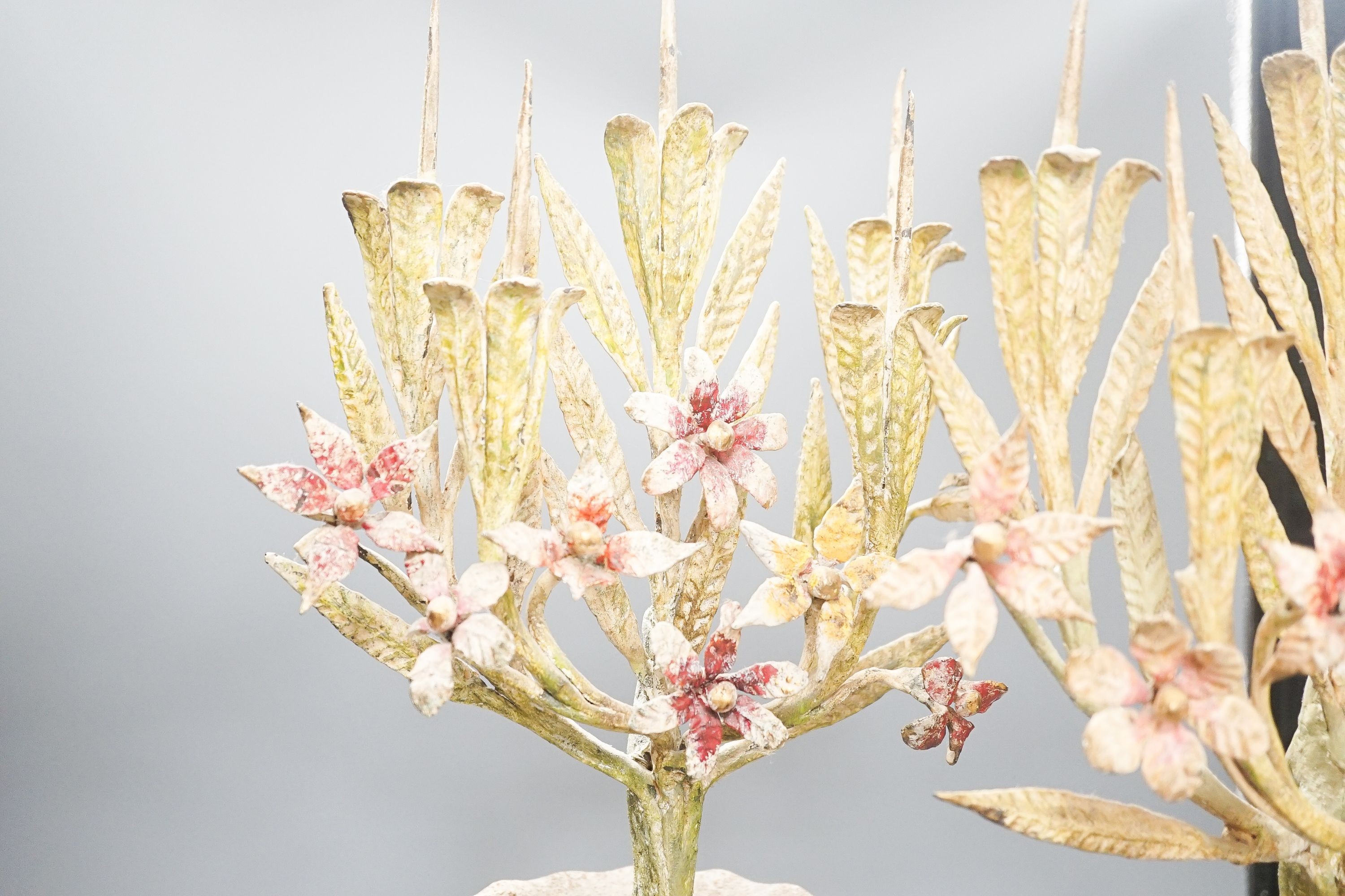 A pair of late 19th/early 20th century painted wrought iron, composition and cast iron 'flower' vases 60cm